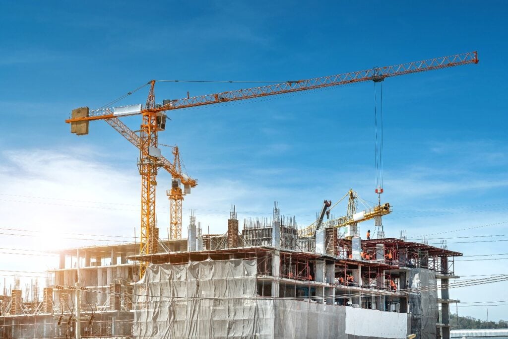 Panorama view at workers are working on large construction sites and many cranes are working in the, Industry new building business.